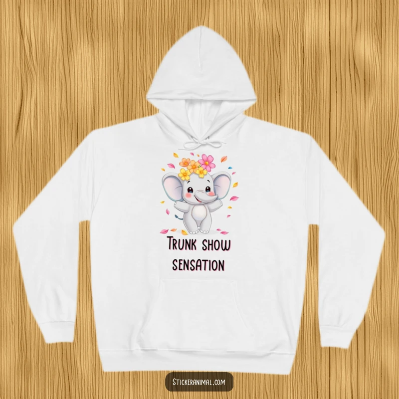 Funny elephant hoodie depicting a smiling animal skillfully juggling a vibrant array of flower petals, perfect for cozy, happy moments.