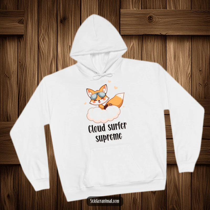 Funny Fox Hoodie: A fox pilots a fluffy cloud in a dreamlike sky, offering cozy escapism and humorous charm.