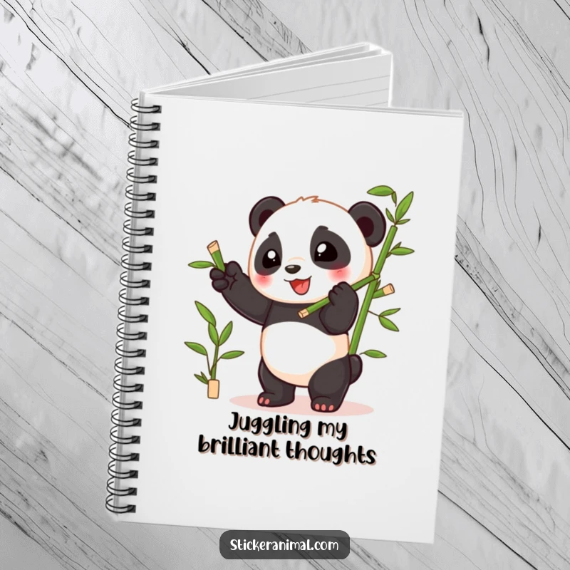 Funny playful panda cub juggling bamboo shoots with glee, featured on the cover of a cheerful notebook for writing.