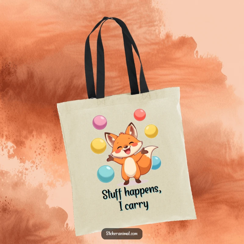Funny tote bag featuring a grinning fox skillfully juggling oversized, colorful balls, perfect for carrying items with a playful spirit.